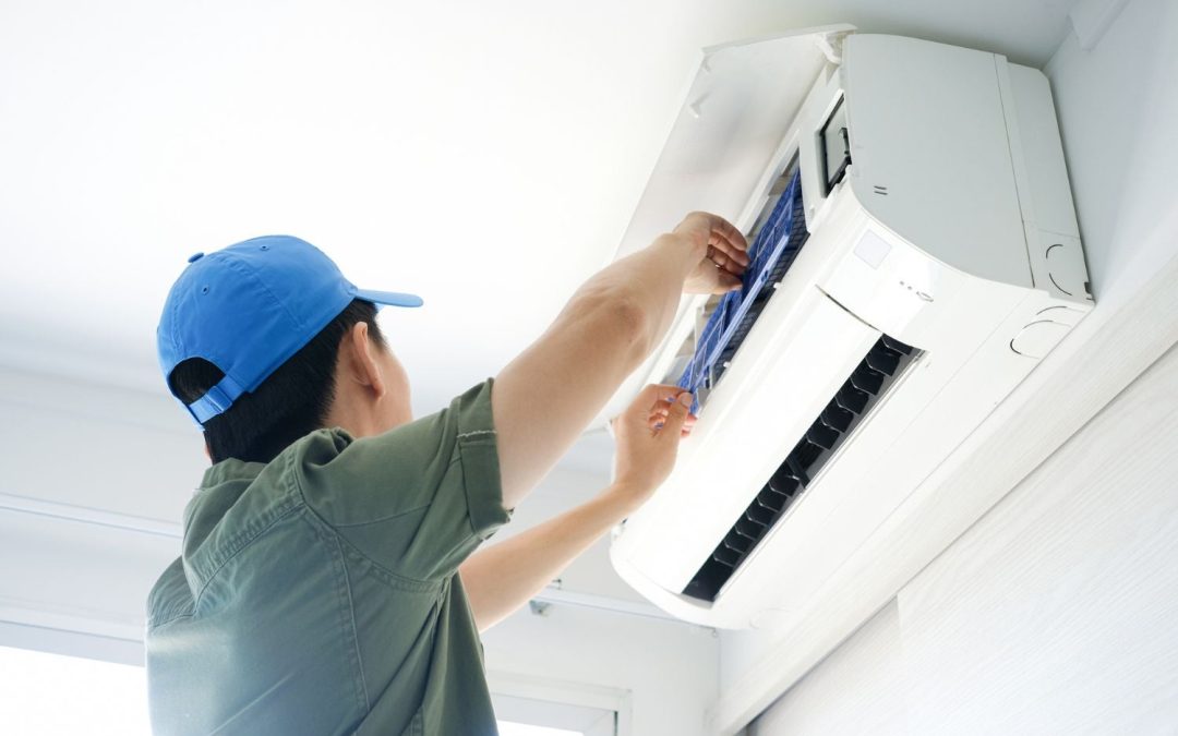 HVAC technician servicing a ductless mini split in Cupertino