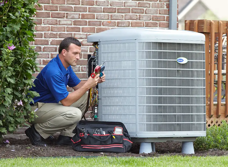 HVAC technician inspecting an outdoor AC unit in Cupertino