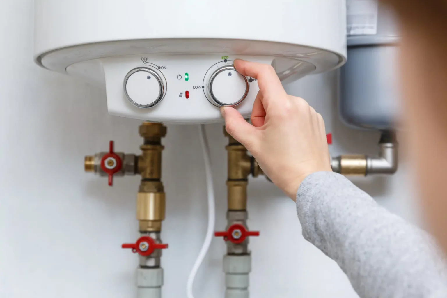 Technician adjusting a water heater in Cupertino